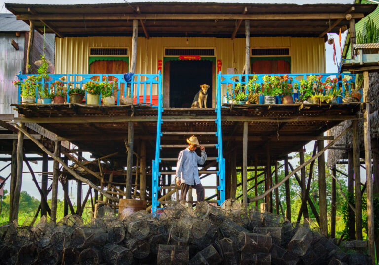 Street photography of a fisherman at his home in Kampong Phluck, near the Tonle Sap, in Siem Reap, Cambodia