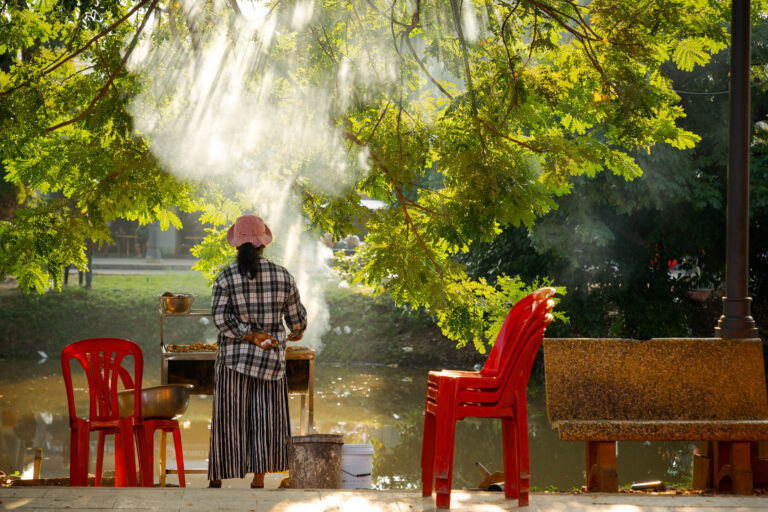 Candid street photography of a street food vendor in Siem Reap, Cambodia