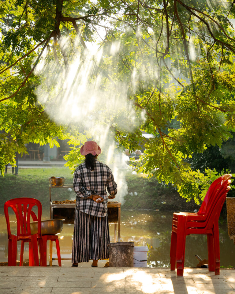 Candid street photography of a street food vendor in Siem Reap, Cambodia