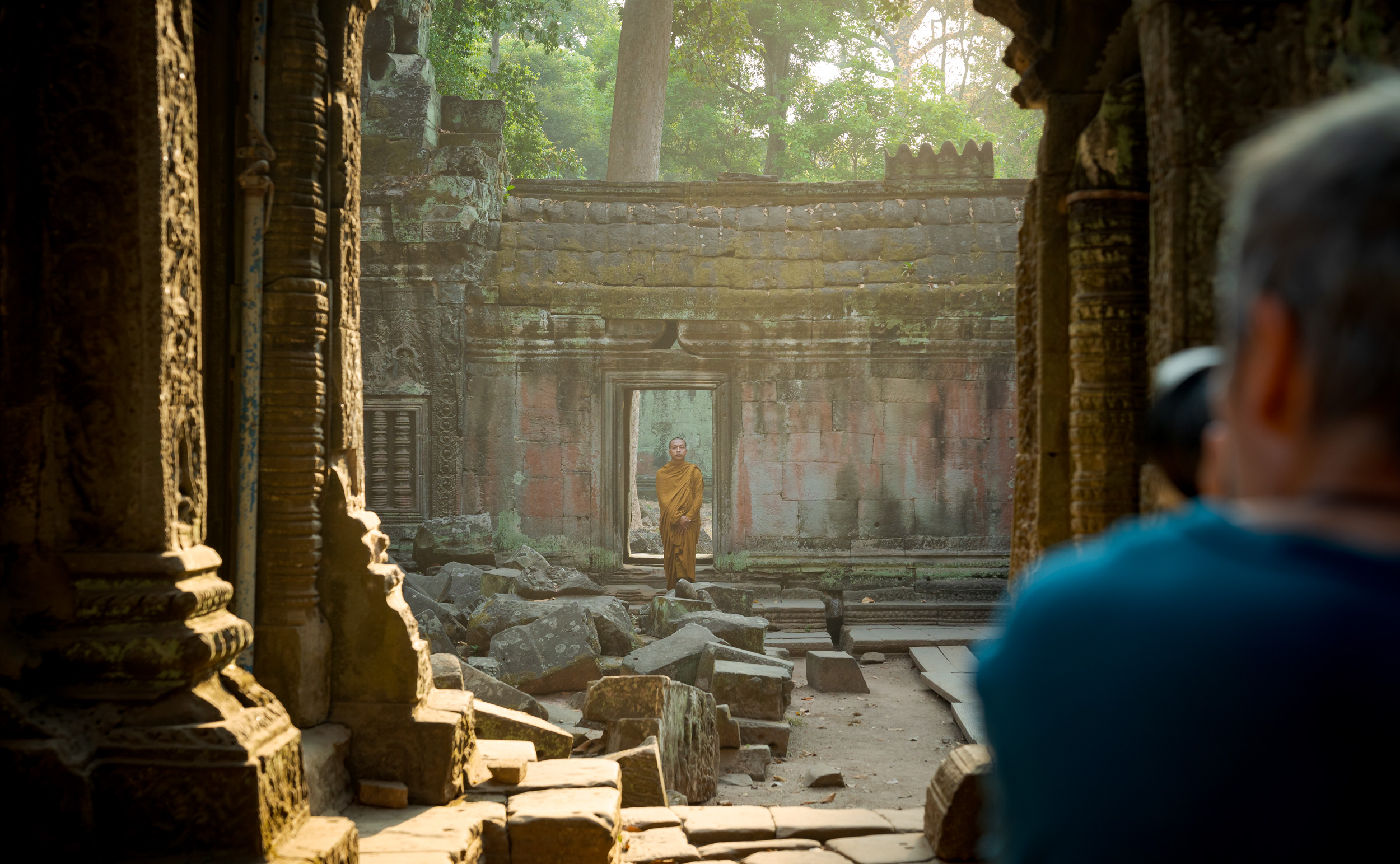 Photographer photographing a Buddhist monk on an Angkor photography tour led by Siem Reap Photographer