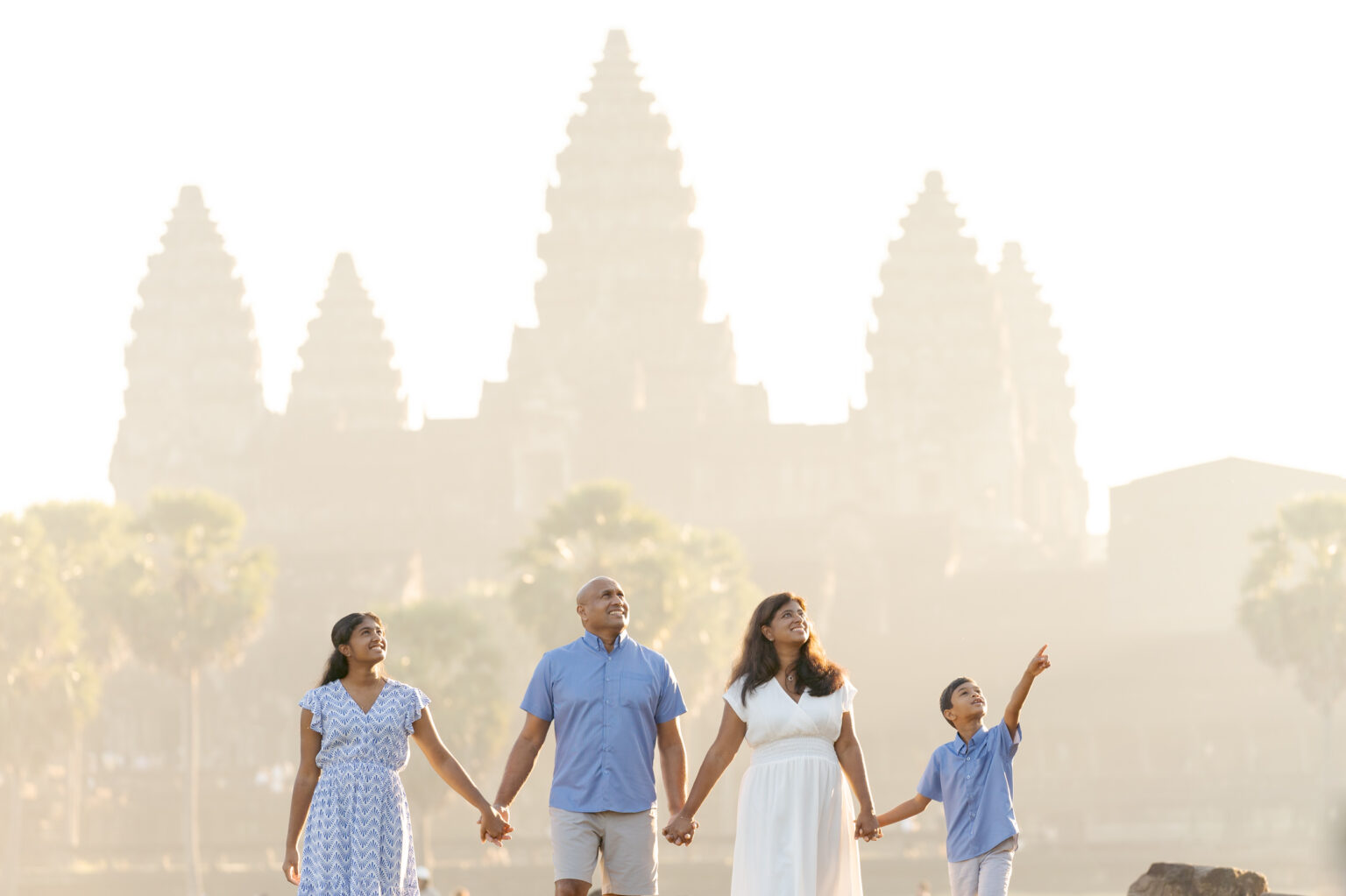 Family on an Angkor Wat photoshoot at sunrise with siem reap photographer