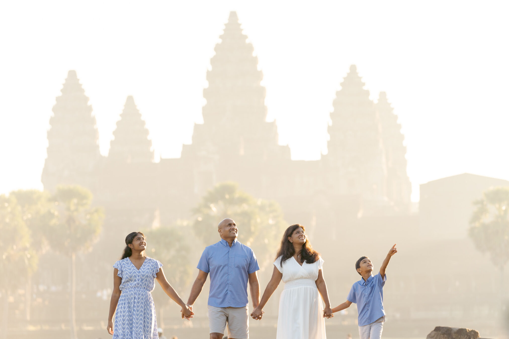 Family on an Angkor Wat photoshoot at sunrise with siem reap photographer