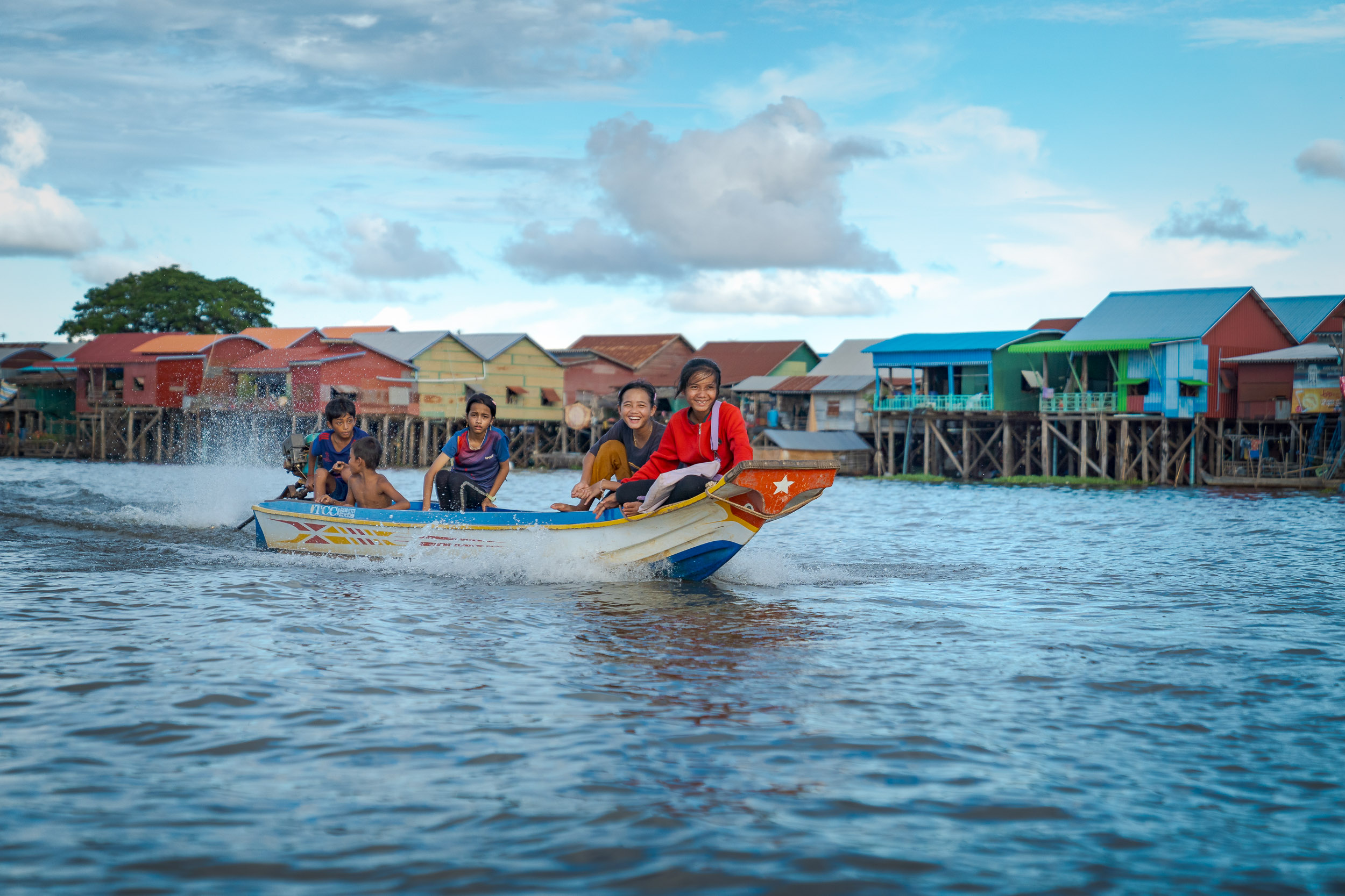 Floating Village photography of kids playing on a siem reap photography tour