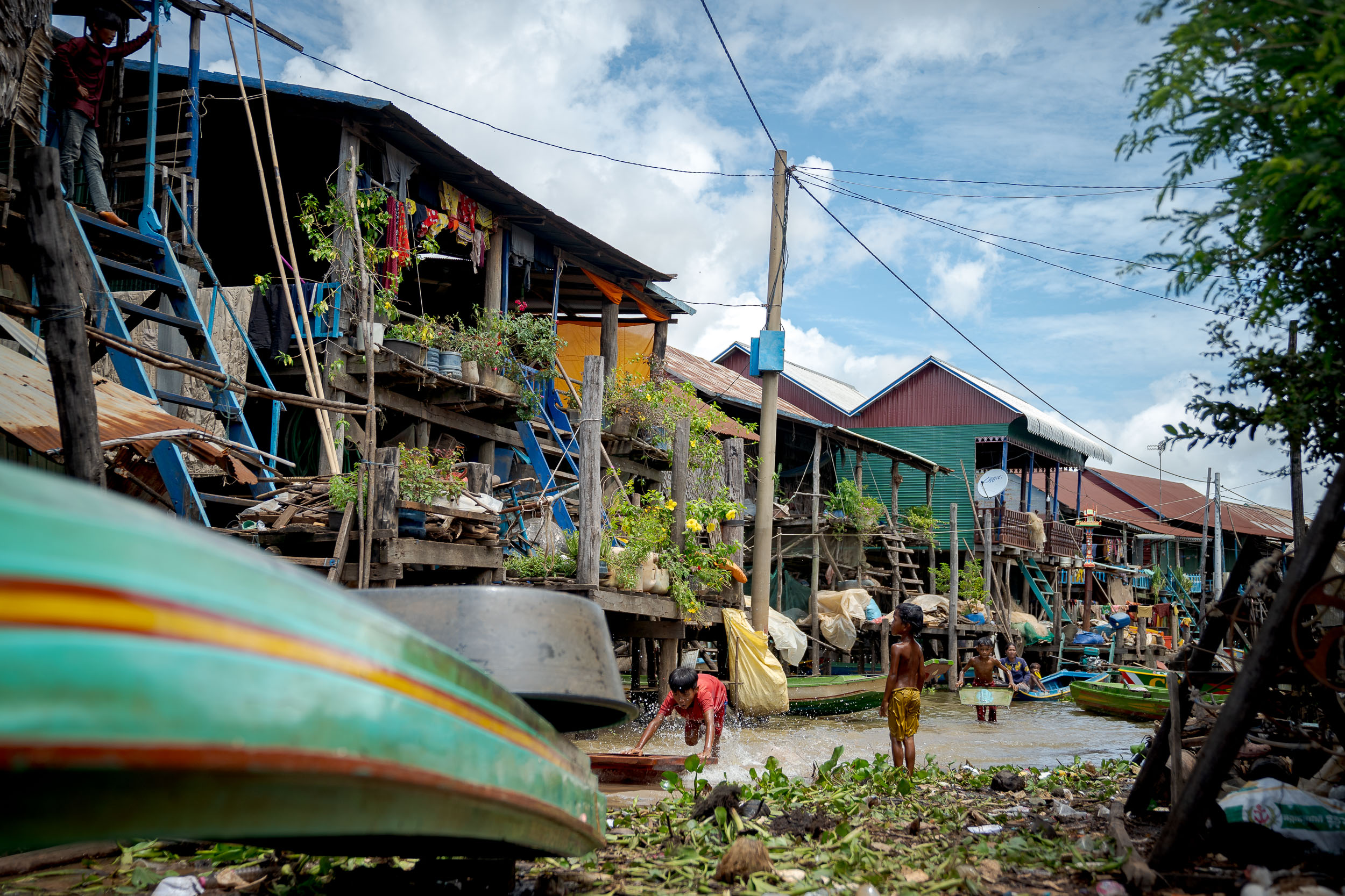 Floating Village photography of kids playing on a siem reap photography tour