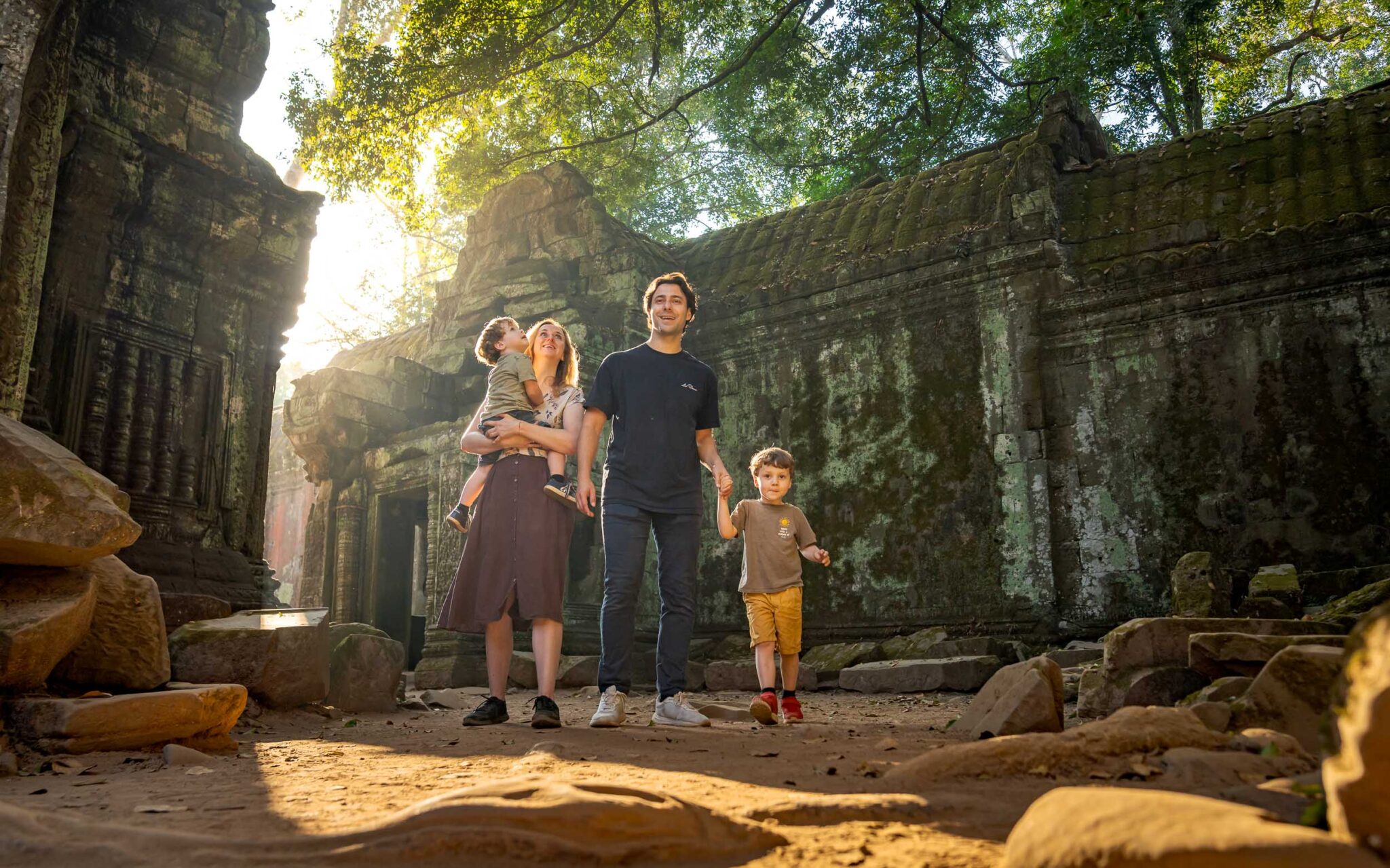 Family at ta prohm temple, cambodia. Captured by Siem Reap Photographer