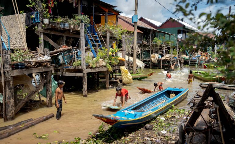 Floating Village photography of kids playing on a siem reap photography tour