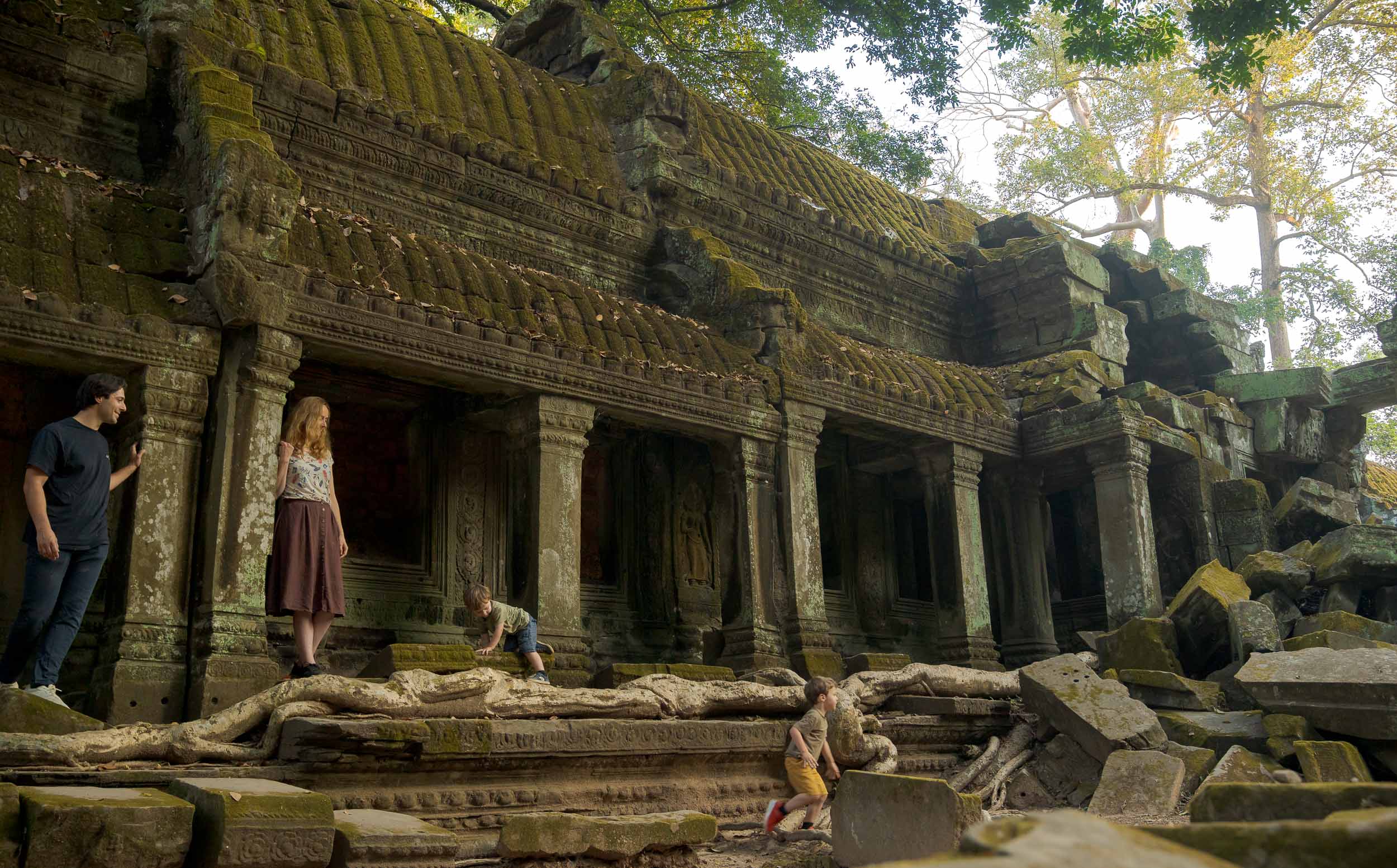 Family on a photoshoot at Ta Prohm Temple, Siem Reap, Cambodia