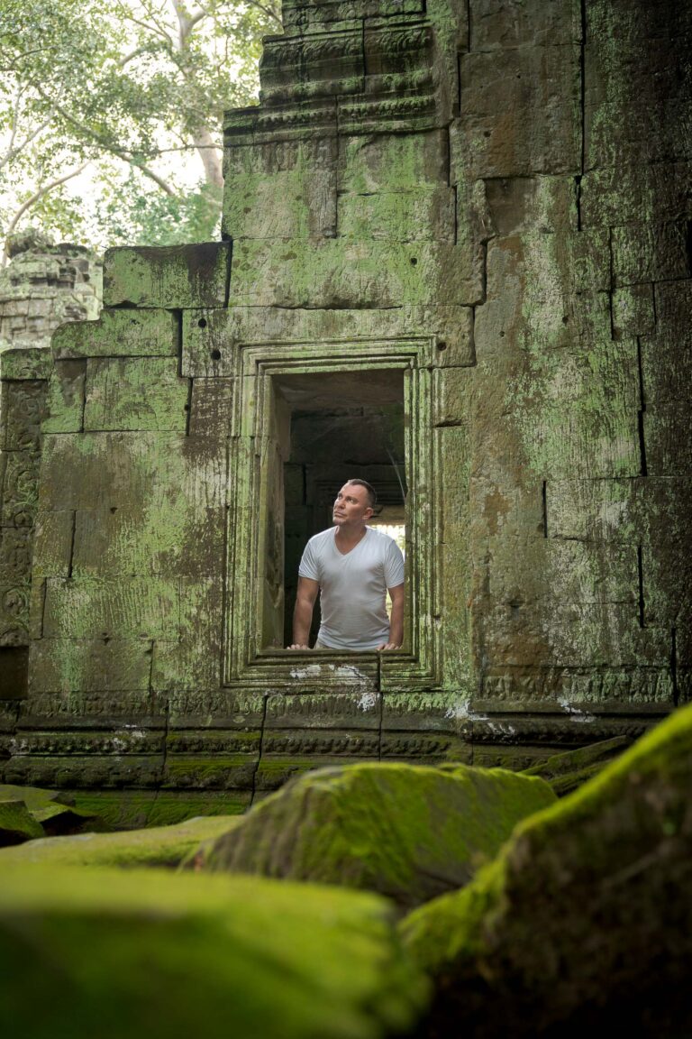 Man at Ta Prohm temple on a photoshoot with siem reap photographer