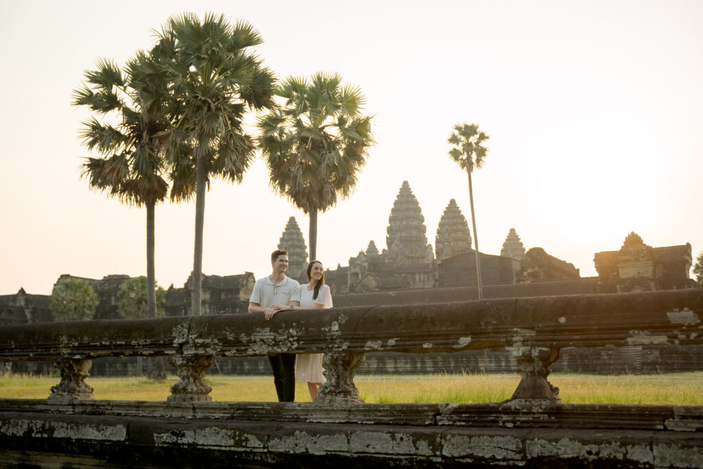distant couple view Angkor Wat sunrise landscape photoshoot
