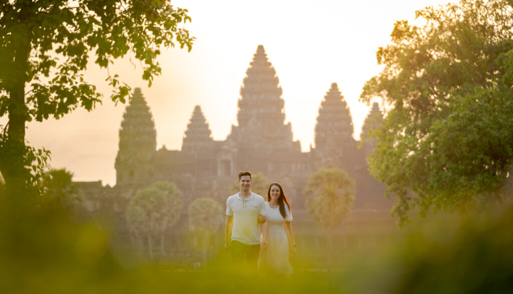 couple walking at sunrise Angkor Wat couples photoshoot Siem Reap