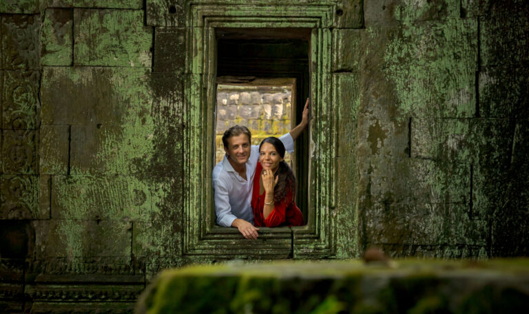 couple at ta prohm temple on a photoshoot with siem reap photographer