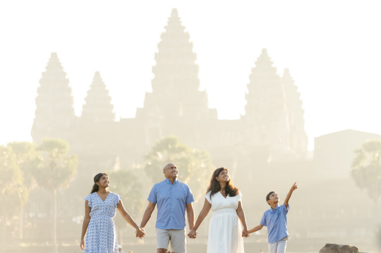family at angkor wat temple on a photoshoot with siem reap photographer wearing all white clothing