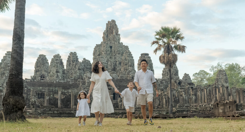 family at bayon temple on a photoshoot with siem reap photographer wearing all white clothing