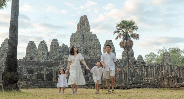 family at bayon temple on a photoshoot with siem reap photographer wearing all white clothing