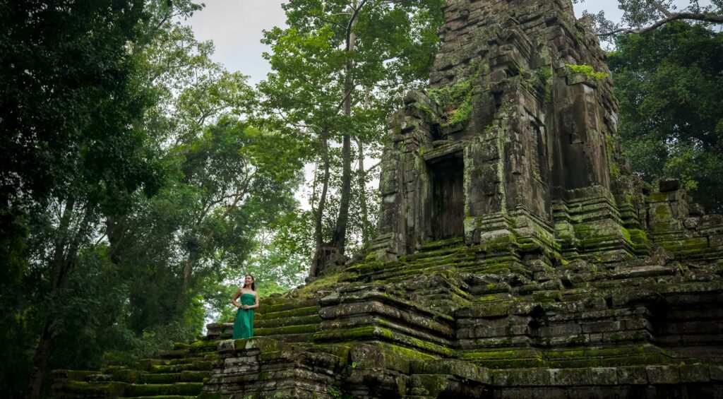 Solo traveller photoshoot at hidden jungle temple near Angkor Wat in Siem Reap