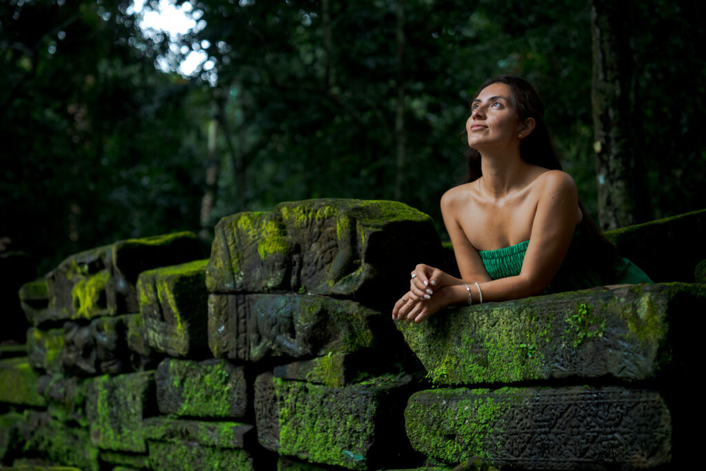 Solo traveller photoshoot at hidden jungle temple near Angkor Wat in Siem Reap