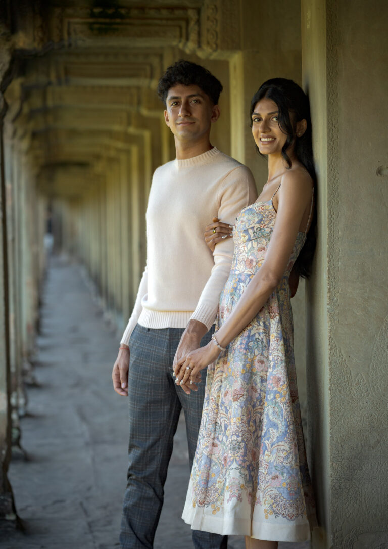 Couple holding hands during Angkor Wat proposal photoshoot in Siem Reap