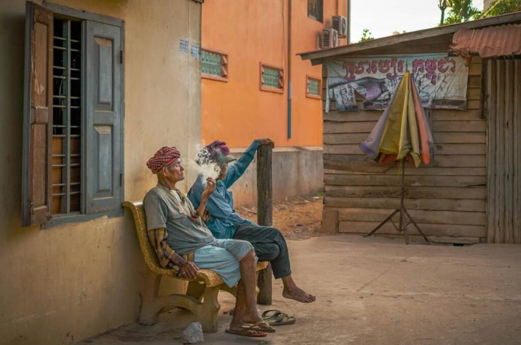 old men smoking on the street in siem reap