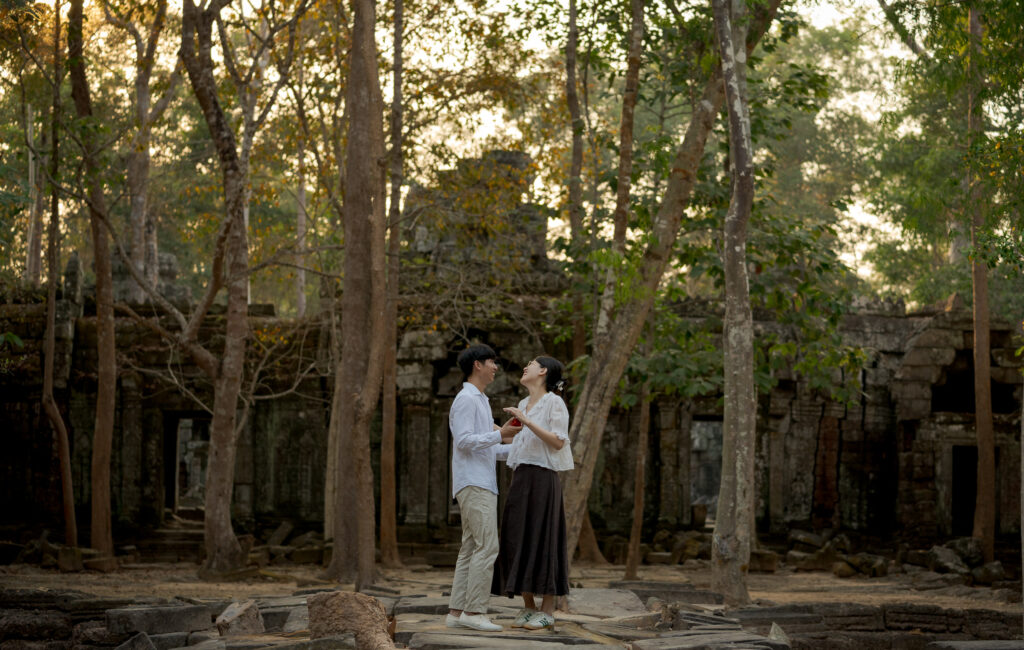 Couple photographed among the ruins of Ta Nei Temple