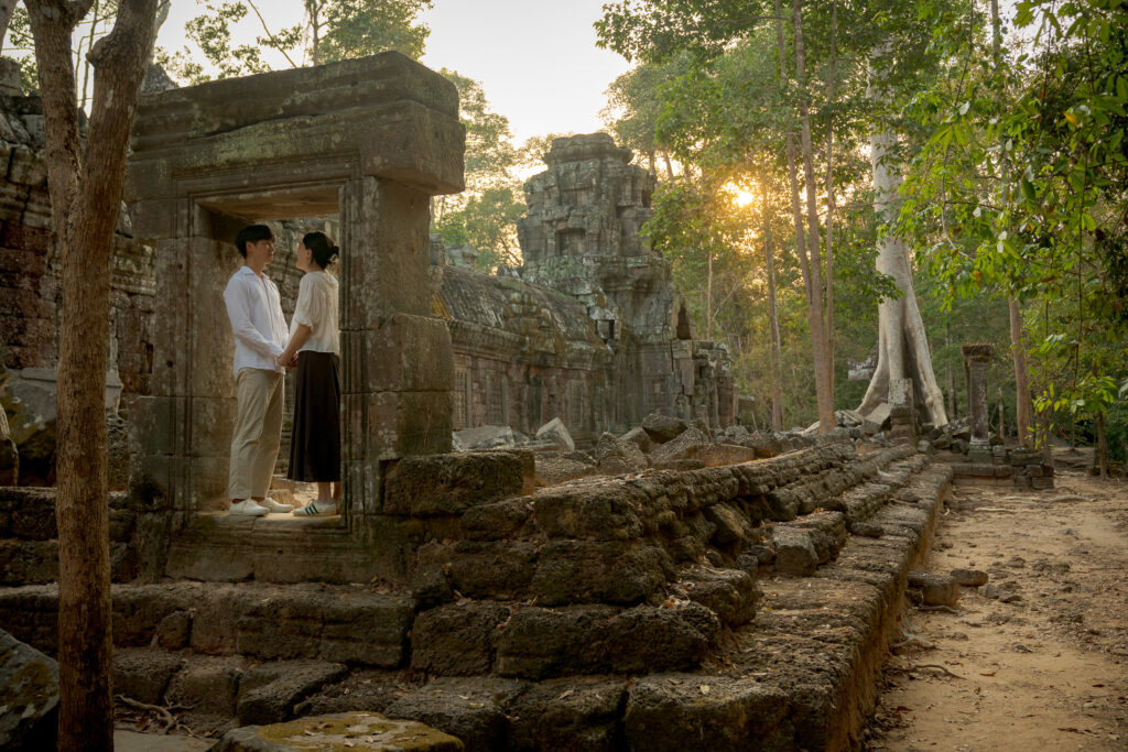 Couple embracing moments after their Ta Nei Temple proposal
